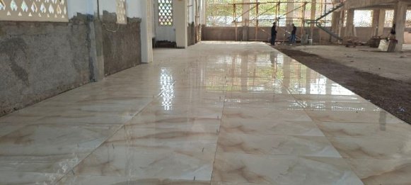 A large white tiled floor AI-generated content may be incorrect.