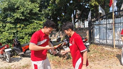 Two men in red shirts AI-generated content may be incorrect.