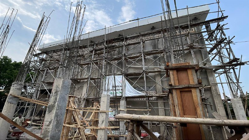 A building under construction with scaffolding

AI-generated content may be incorrect.
