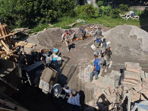 A group of men working on a construction site

AI-generated content may be incorrect.