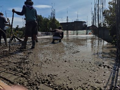 A group of people working on a wet road

AI-generated content may be incorrect.