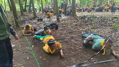 People in yellow jackets lying on the ground

AI-generated content may be incorrect.